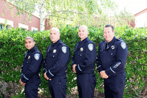 Antioch Police Chief Allan Cantando (left) with three new hires.